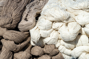 coils of natural sheep wool yarn