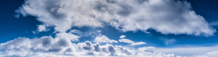 Real wide blue sky background with clouds of northern winter Sweden. panorama