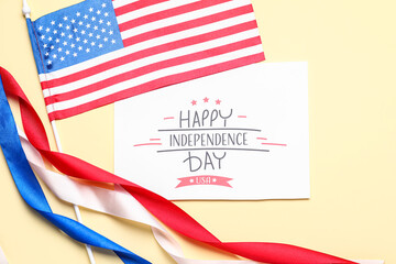 Greeting card with text HAPPY INDEPENDENCE DAY, USA flag and ribbons on beige background