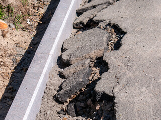 sidewalk repairs. replacement of the curb stone. collapsed asphalt