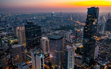 Fototapeta premium Aerial view of King Power Mahanakhon tower in Sathorn Silom central business district of Bangkok, Thailand