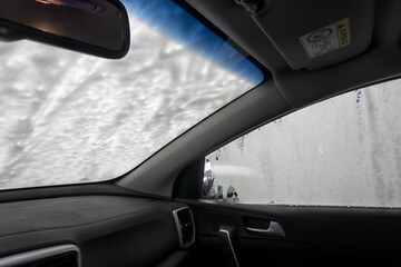 Automatic conveyorized tunnel car wash. A view from inside.
