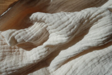 Crumpled simple thin white cotton muslin fabric