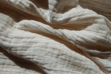 Fototapeta na wymiar Jammed simple thin white cotton muslin fabric
