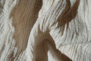 Rumpled simple thin white cotton muslin fabric