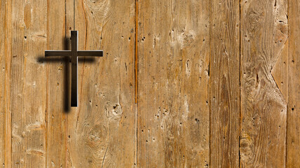 Christian wooden cross on a background of walls