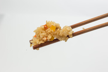 Rice with vegetables on sticks on a white background. food photography