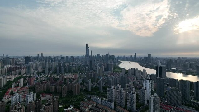 Drone aerial view of Buildings, cityscape and river in downtown. Aerial view of rows of office buildings and residential area in Shanghai China.  Business travel transportation concept b-roll footage.