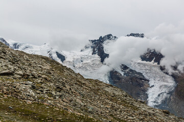 Fototapeta na wymiar Panorama of cloud layer from mountain top over Swiss alps