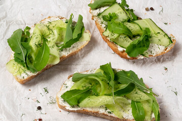 Sandwiches with vegetable ricotta and green fresh veggies
