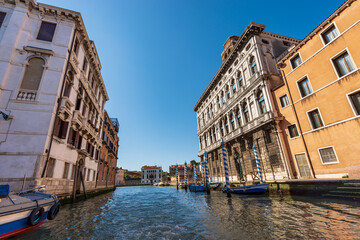 Venice cityscape view from a ferry. Cannaregio Canal and Grand Canal (Canal Grande) with ancient...