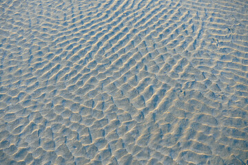 Fototapeta na wymiar White beach sand surface pattern abstract.