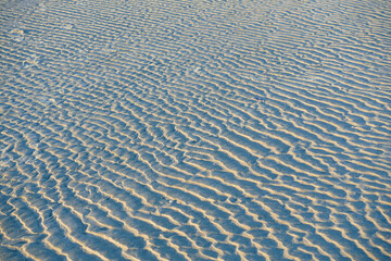 Fototapeta na wymiar White beach sand surface pattern. Abstract.