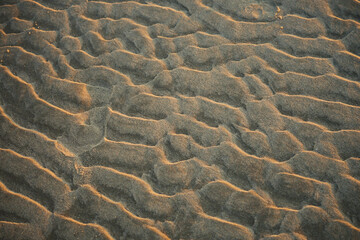 Ripped pattern sand surface abstract. Close up. High angle view.