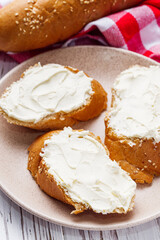 baguette cream cheese sandwich on a white background