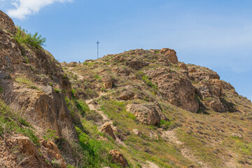 Orthodox cross on top of a cliff near Khor Virap Monastery in Armenia