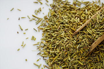 fragrant dried rosemary on a white acrylic background
