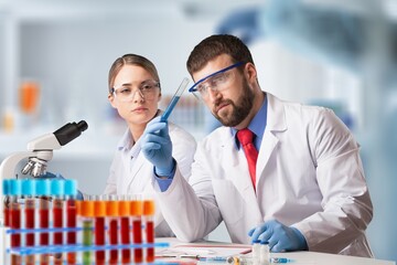 Woman scientist working in lab. Research concept. Microscope at blood and chemical test sample