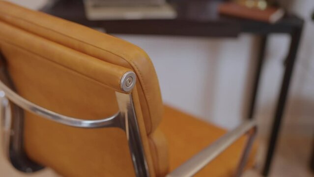 close up of leather working chair in home office home interior background dolly shot of interior detail design of modern office chair at home