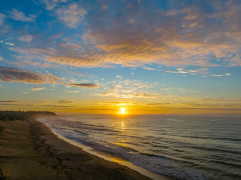 Aerial sunrise seascape with  high cloud