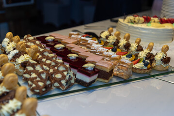 plates filled with pieces of different cakes