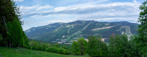 Panorama of the Śnieżnik Massif Mountains - the village of Dolni Morava with the observation tower Walk in the Clouds - obrazy, fototapety, plakaty