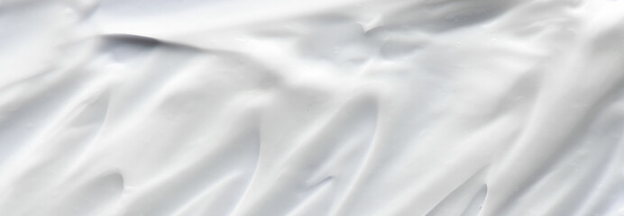 Hand cream or serum with retinol for the face or hair conditioner or mask balm or shower gel. Textured background