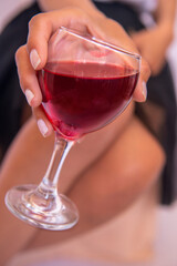 attractive woman holding wine glass