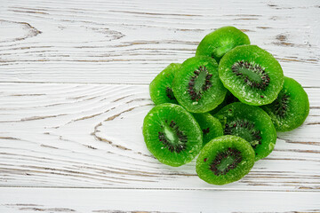 green dried kiwi on a white wooden rustic background