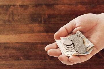 Bunch of Russian rubles are counted in the human hand