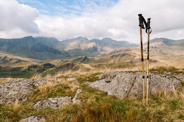 Walking poles and view of the Scafell Range in the English Lake District