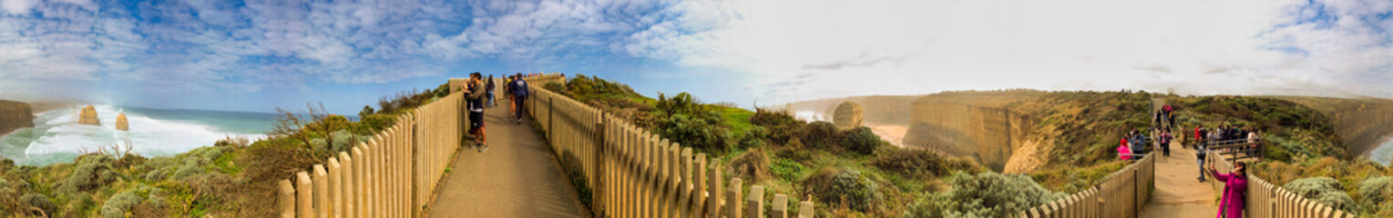 Port Campbell, Australia - September 19, 2018: The Twelve Apostles rock formations along the Great Ocean Road, panoramic view with tourists