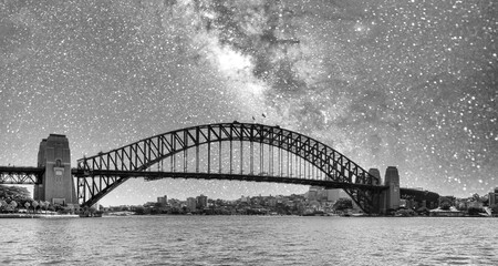 Panoramic view of Sydney Harbour Bridge on a starry night, New South Wales - Australia.