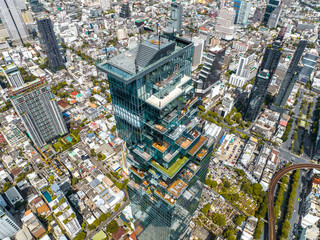 Fototapeta premium Aerial view of King Power Mahanakhon tower in Sathorn Silom central business district of Bangkok, Thailand