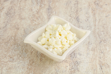 Grained cottage cheese in the bowl