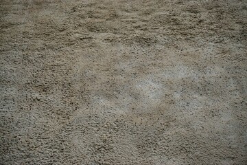 Alte braun-graue Betonfassade mit Muster 