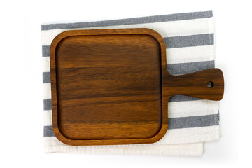 Empty wooden tray with cloth isolated on white background. Mock up. Selective focus.