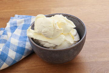 Italian soft mascarpone cheese in the bowl
