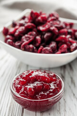 dried cranberry berry on a white wooden rustic background