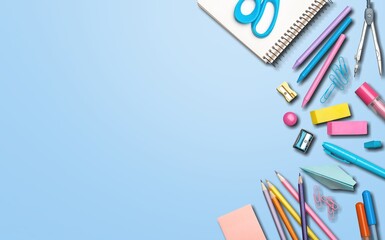 School stationery, color pencils, notepad on table. Back to school concept.