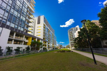 Obraz na płótnie Canvas Residential high rise apartment building in inner Sydney suburb NSW Australia. Residential complex in leafy suburbia. Urban living high density suburban city 
