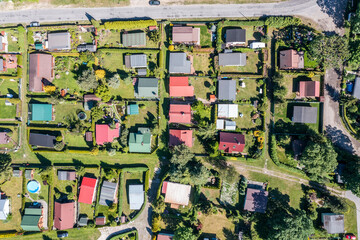 The view from the drone on the small houses on the estate next to each other. Landscape from the drone.