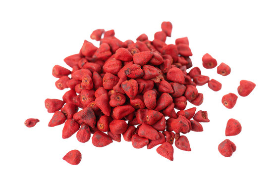 Annatto seeds, isolated on a white background. Achiote seeds, bixa orellana. Natural dye for cooking and food. Close-up. Top view.