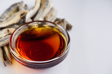 fragrant fish sauce on a white acrylic background