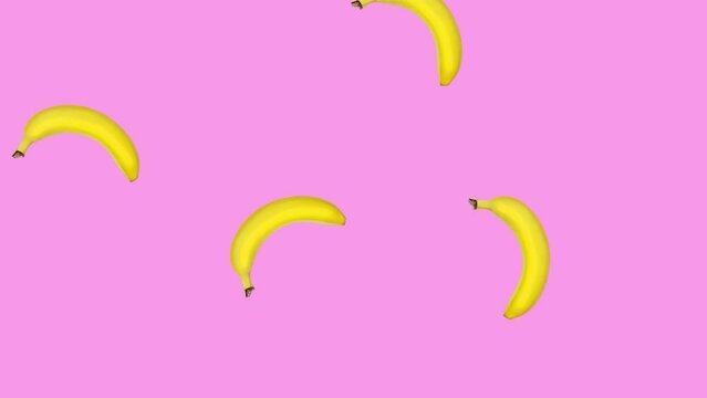 Abstract colorful animation - bananas falling and rotating at pink color background. Seamless loop animation.