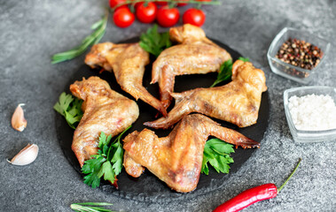grilled chicken wings on stone background