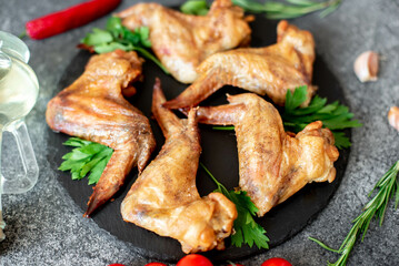 grilled chicken wings on stone background