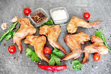 grilled chicken wings on stone background