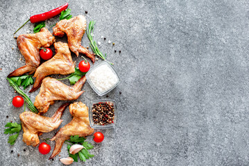 grilled chicken wings on stone background with copy space for your text