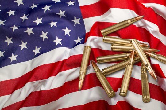 Bullets with an USA flag on a black wood background